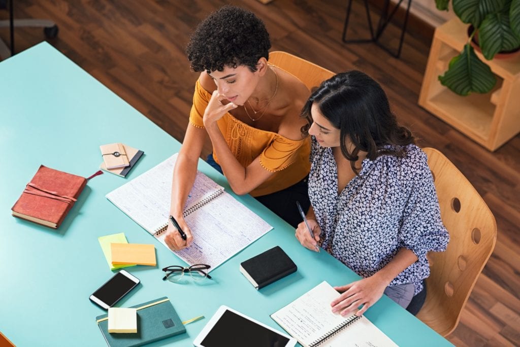 Student friends studying together at American Admissions